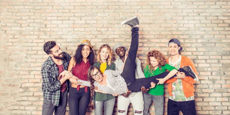 Credit Union Marketing Strategies for Generation Z? a group of young adults holding up their friend