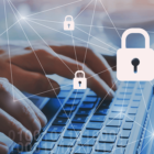 Image: Person typing on a keyboard with padlock icons hovering above