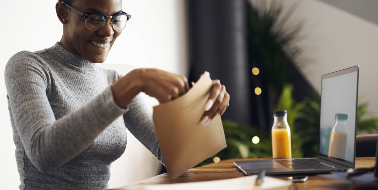 Top 5 Myths About Millennials and Direct Mail young person opening up an envelope
