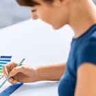 Image: person looking on print color swatches.