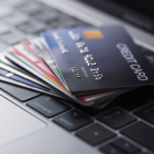 Credit cards sitting on a keyboard.