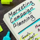 a notebook with marketing campaign planning highlighted