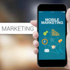 Image: person holding a smartphone that say mobile marketing.