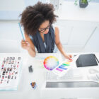 Woman choose color from color wheel.