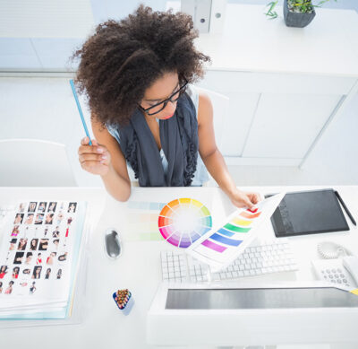 Woman choose color from color wheel.